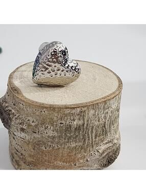 9 Lia Sophia "Queen of Hearts" hammered silver-tone ring.